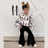 Children's boutique white bell sleeve top with leopard print trees, paired with black velvet bell bottom pants.