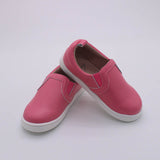 Pink leather children's boutique shoes in a slip on slide.