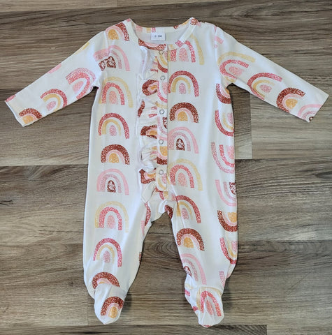 Baby girl white long sleeve romper with rainbows, front ruffle, and snaps.