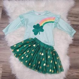 Girls boutique rainbow clover top with green tulle skirt adorned with gold shamrocks.