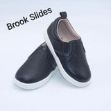 Unisex boutique black leather slip on shoe.