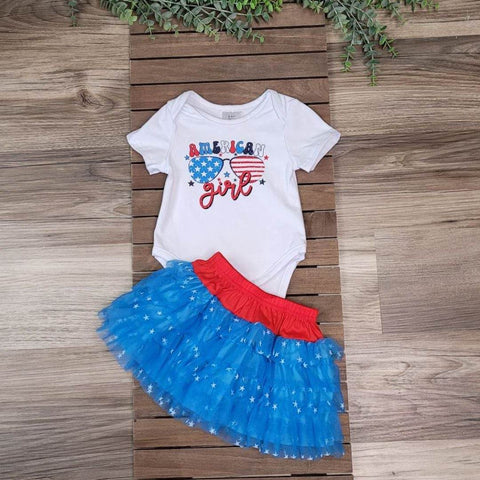 Baby girl skirt set.  Onesie with "American Girl" paired with blue tulle skirt with star print, and red waistband. 