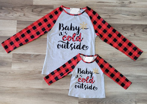 Mom and me matching tops, sold separately "Baby It's Cold Outside" top with red and black buffalo plaid print sleeves.