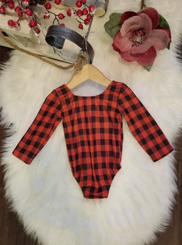 Buttery soft buffalo plaid leo with slight scoop in back.  Snap closure.