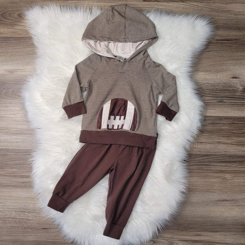 Boys brown striped hooded top with a football applique, paired with brown jogger pants.