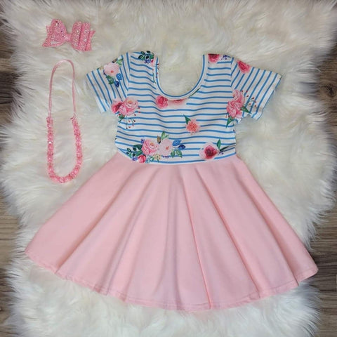 Girls boutique dress, short sleeve, full twirlable skirt, slight scoop back.  The pink  skirt of the dress is accented by a striped floral pattern on the body of this gorgeous dress.