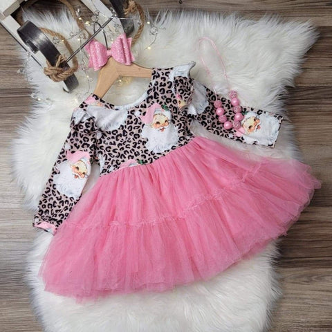 Children's boutique holiday dresses.  Leopard print with Santa in pink hat, and pink tulle skirt.